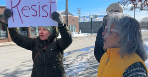 Members of The Audacity sing on the corner of Park Street and Main Street in Rockland, Maine on a cold February day in 2025.