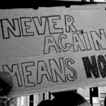 Never Again protest sign